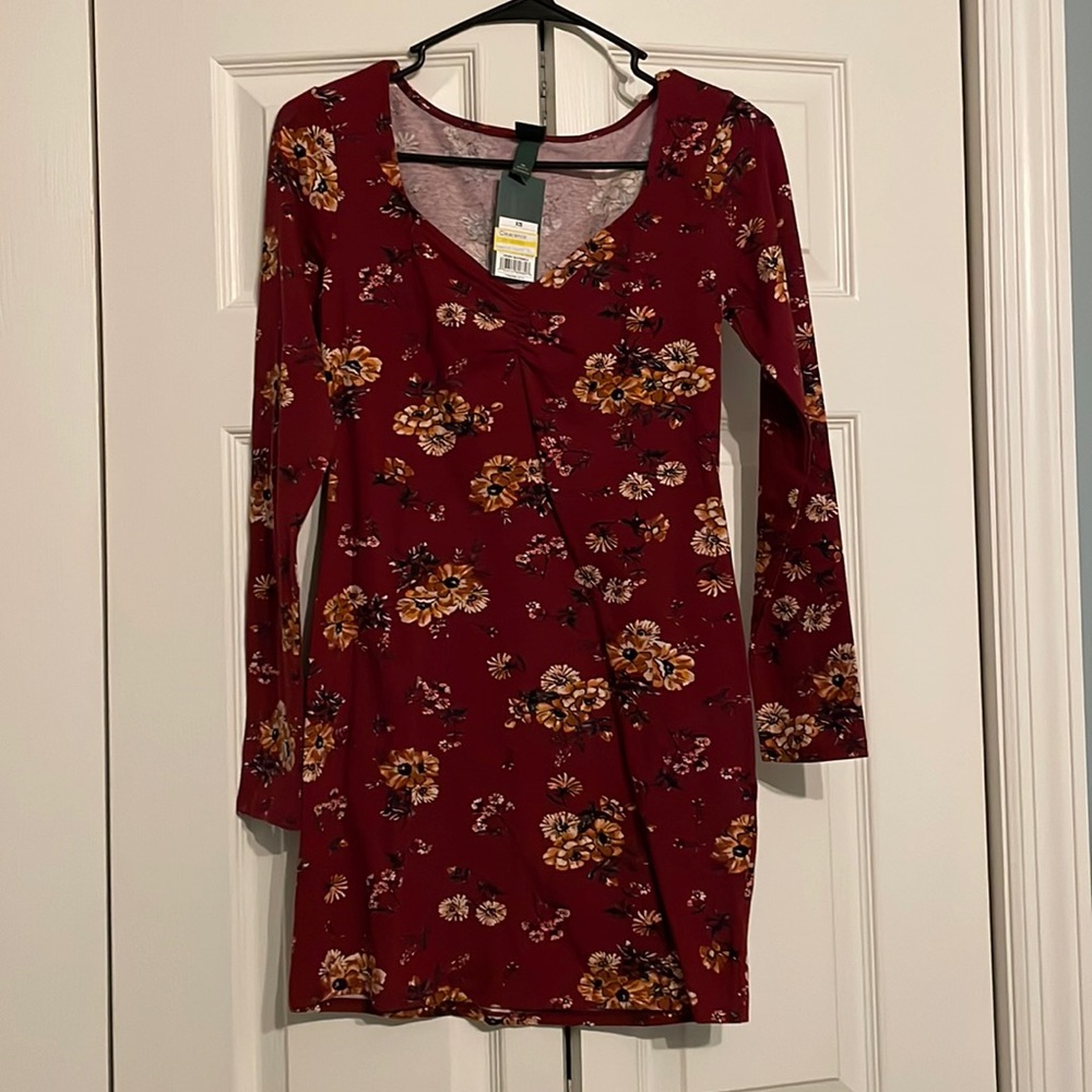Wild Fable size XS form fitted, long sleeved dress. Maroon with yellow flowers.
